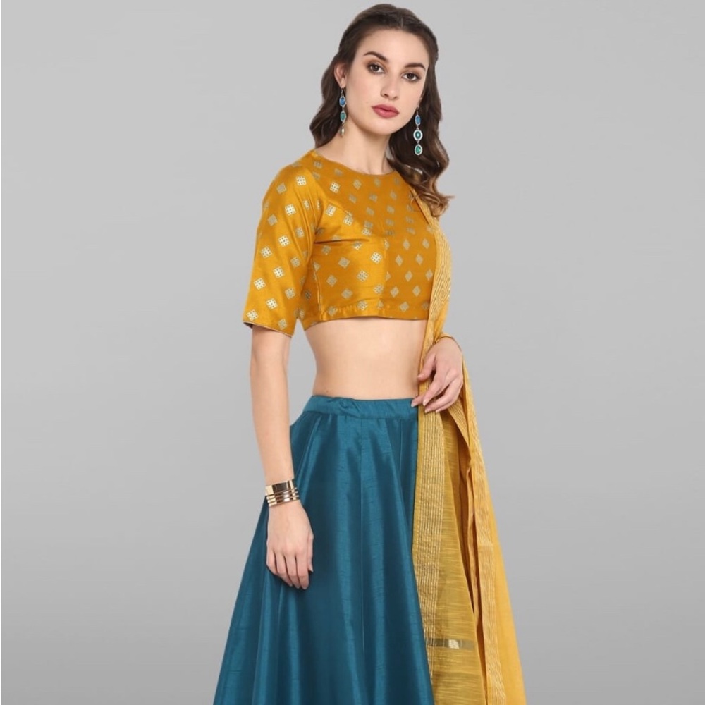 lehenga choli by Janasya mustard yellow and teal